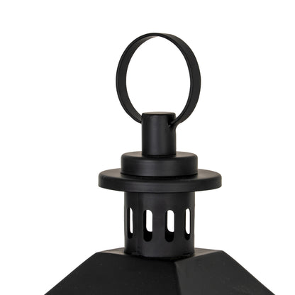 Black lantern with hexagonal design and ring handle on a white background