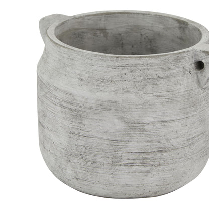 Concrete pot with a textured surface on a white background
