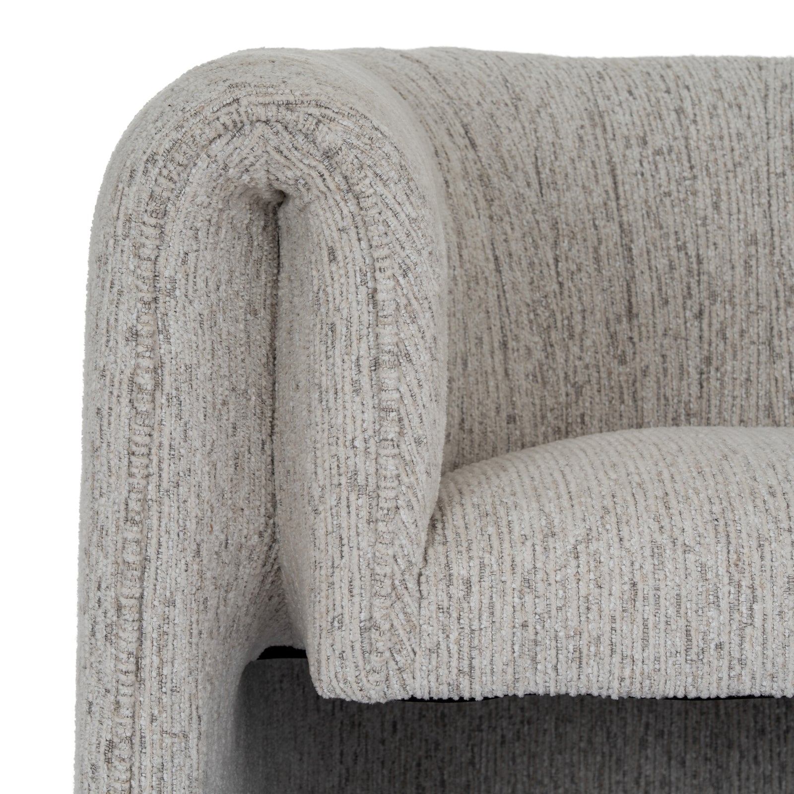 Close-up of a textured gray sofa armrest