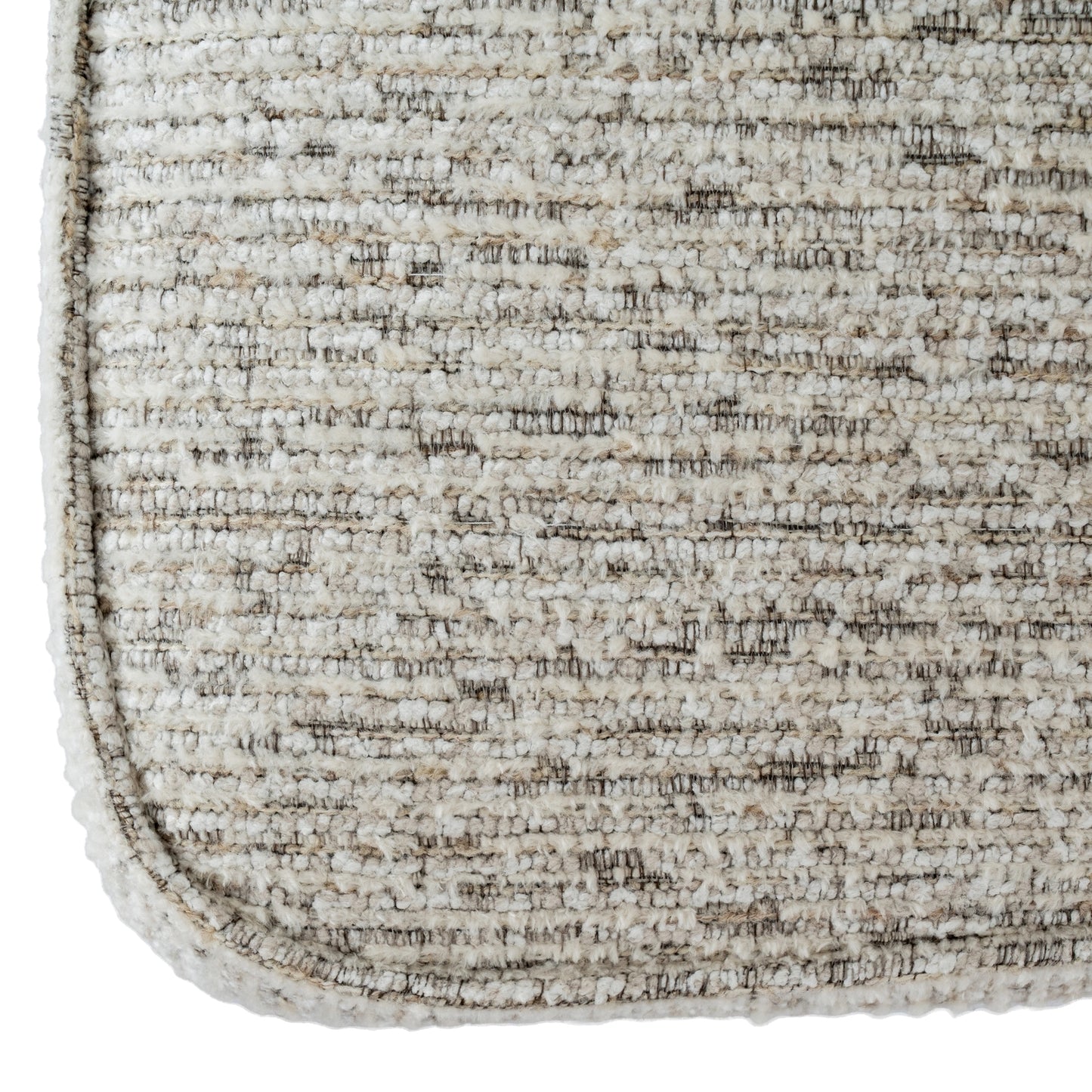 Close-up of a textured beige rug corner