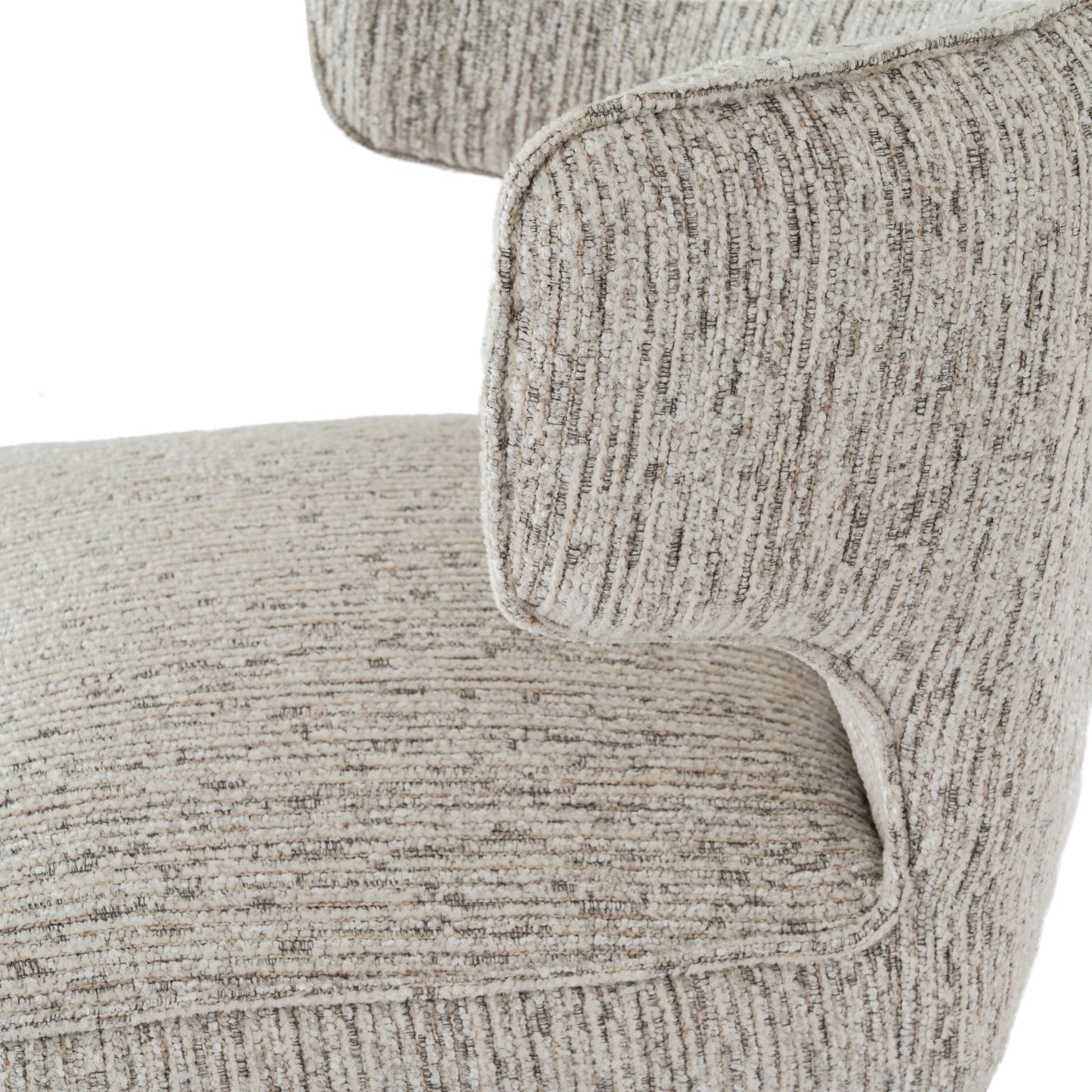 Close-up of a textured beige sofa armrest on a white background