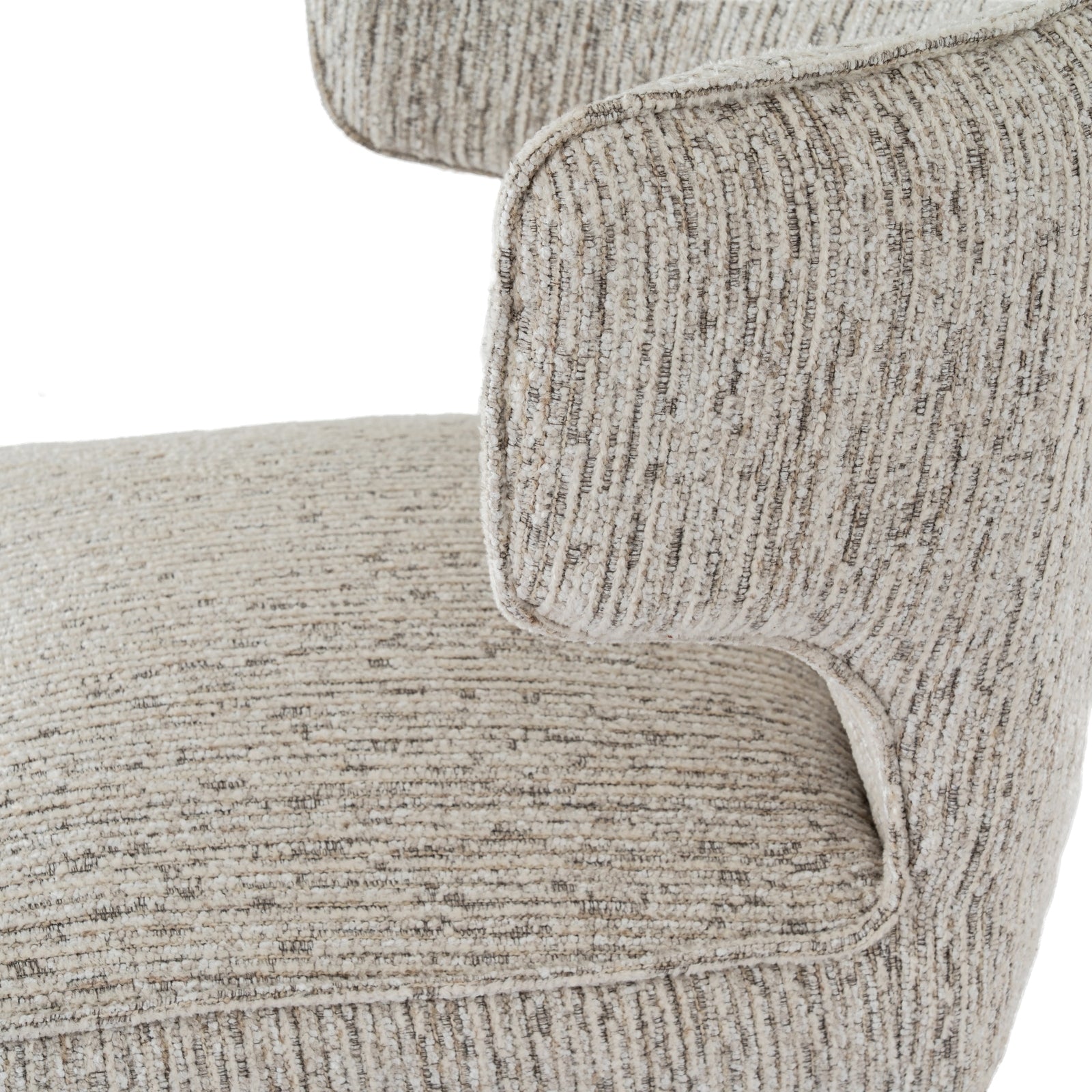 Close-up of a textured beige sofa armrest on a white background
