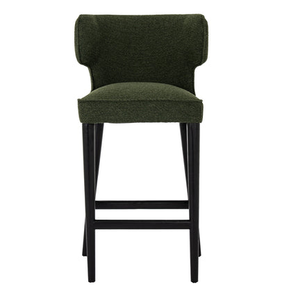 Green bar stool with black legs on a white background