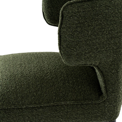 Close-up of a green upholstered chair with a textured fabric.