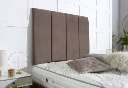 Bed with a large brown headboard in a bedroom setting