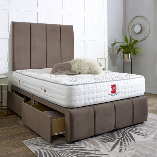 Bed with brown upholstered headboard and drawers in a room setting.