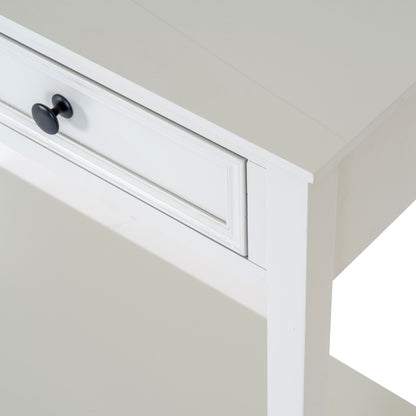 White cabinet with a black knob on a neutral background