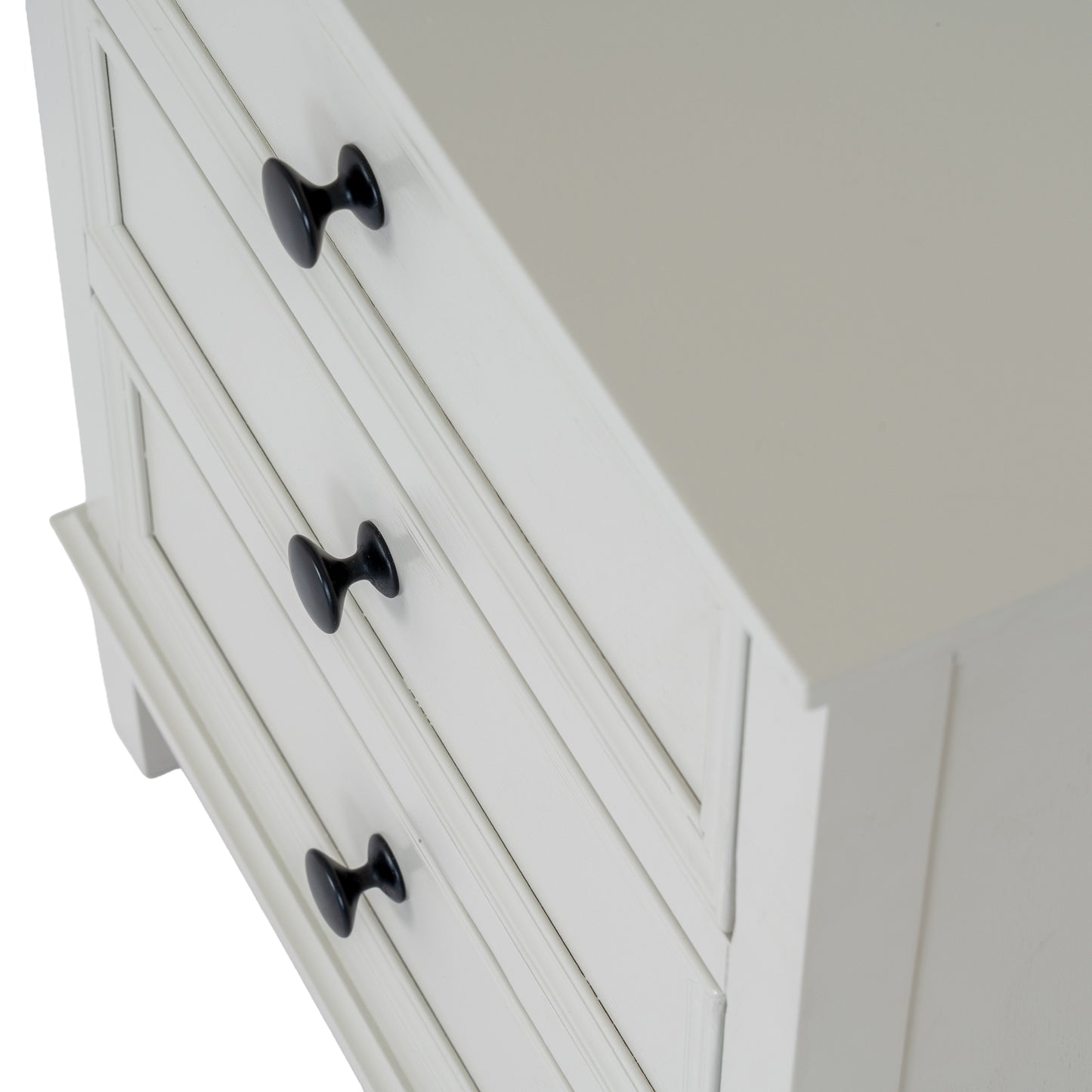 White dresser with black handles on a white background