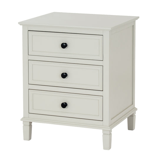 White nightstand with three drawers on a white background