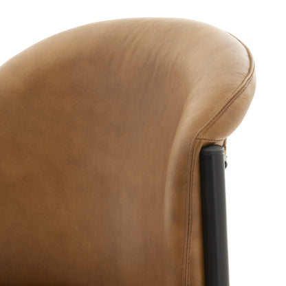 Close-up of a brown leather chair armrest on a white background