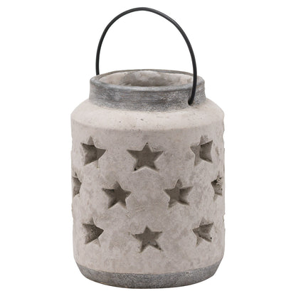 Cement lantern with star patterns and a black handle on a white background