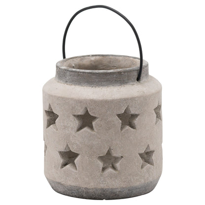 Cement lantern with star patterns and a black handle on a white background