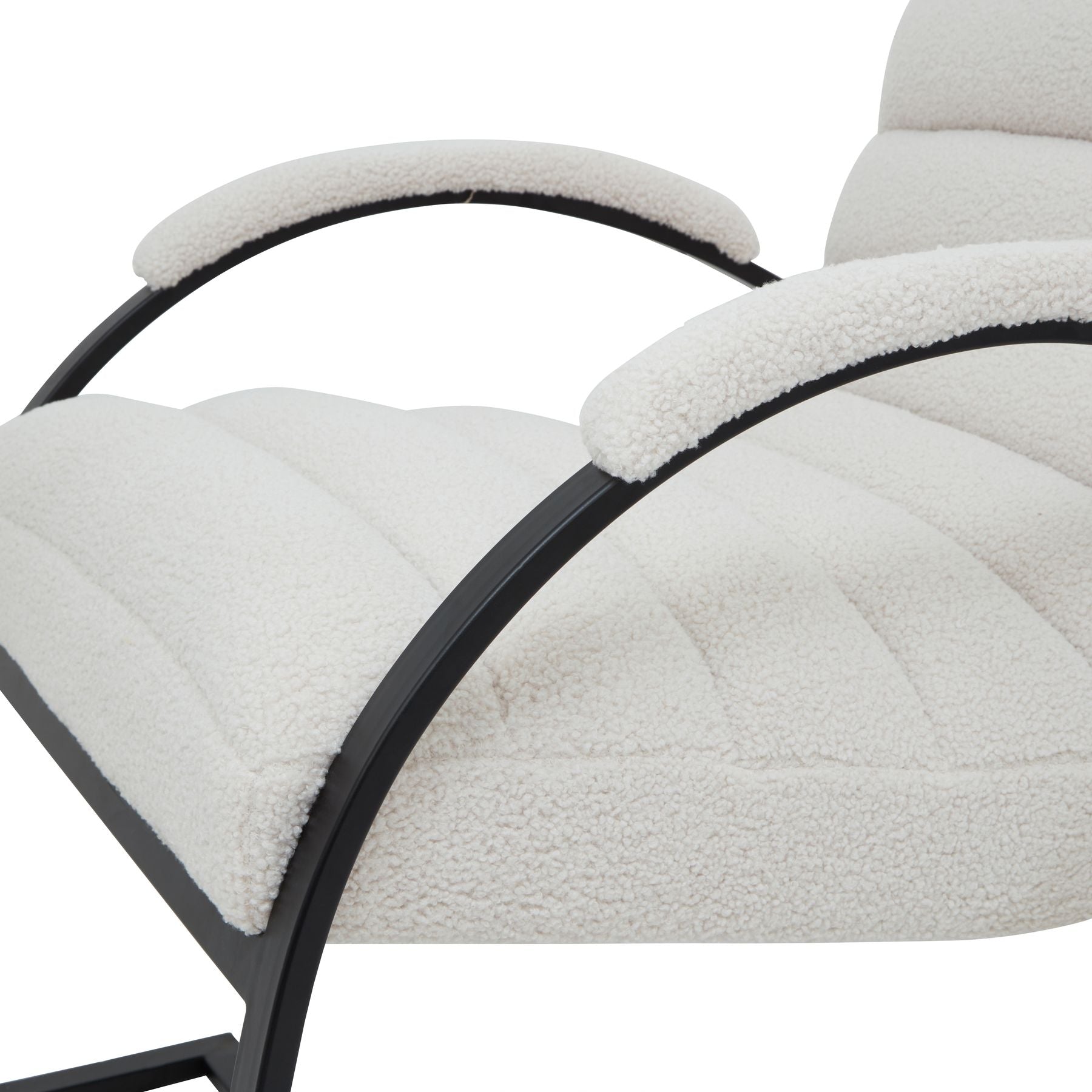 Close-up of a modern chair with white cushioned backrest and black metal frame on a white background.