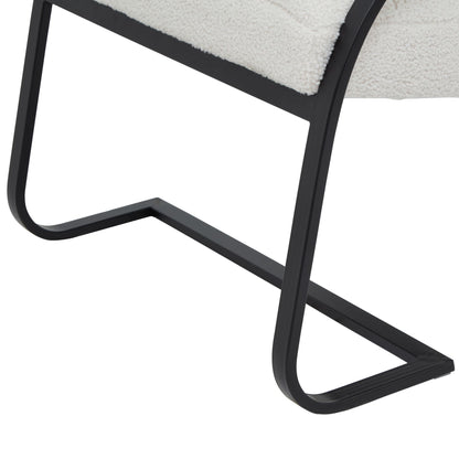 Close-up of a chair with black metal frame and white cushion on a white background