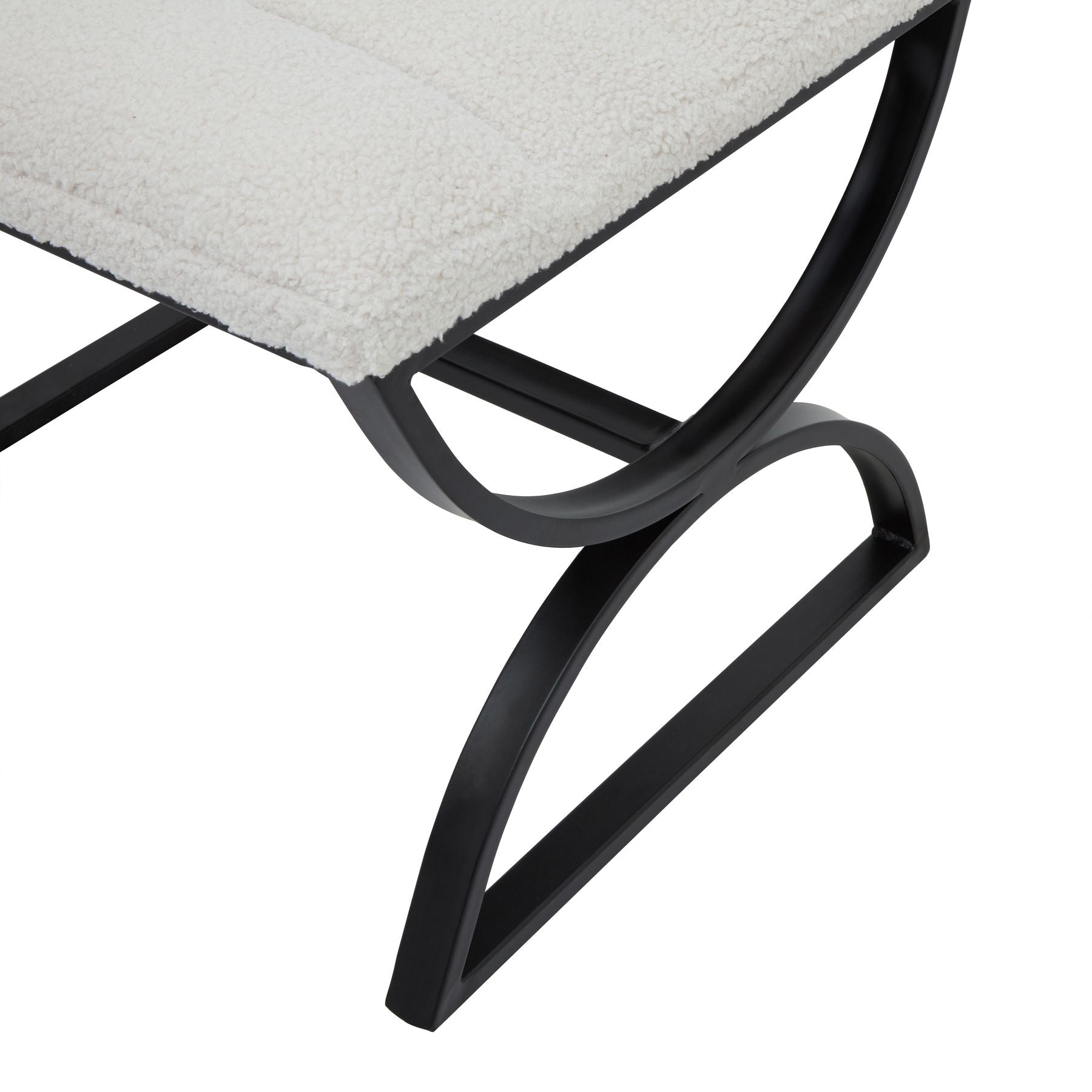 Close-up of a chair with a black metal frame and gray cushioned seat on a white background