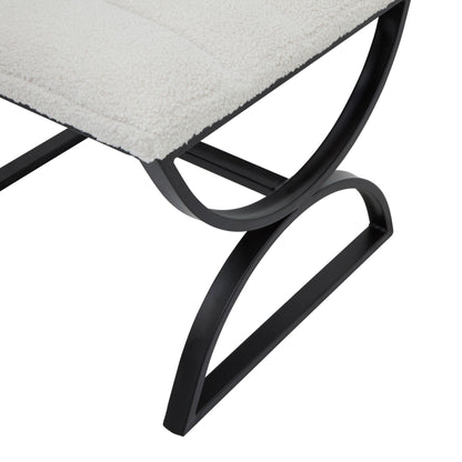 Close-up of a chair with a black metal frame and gray cushioned seat on a white background