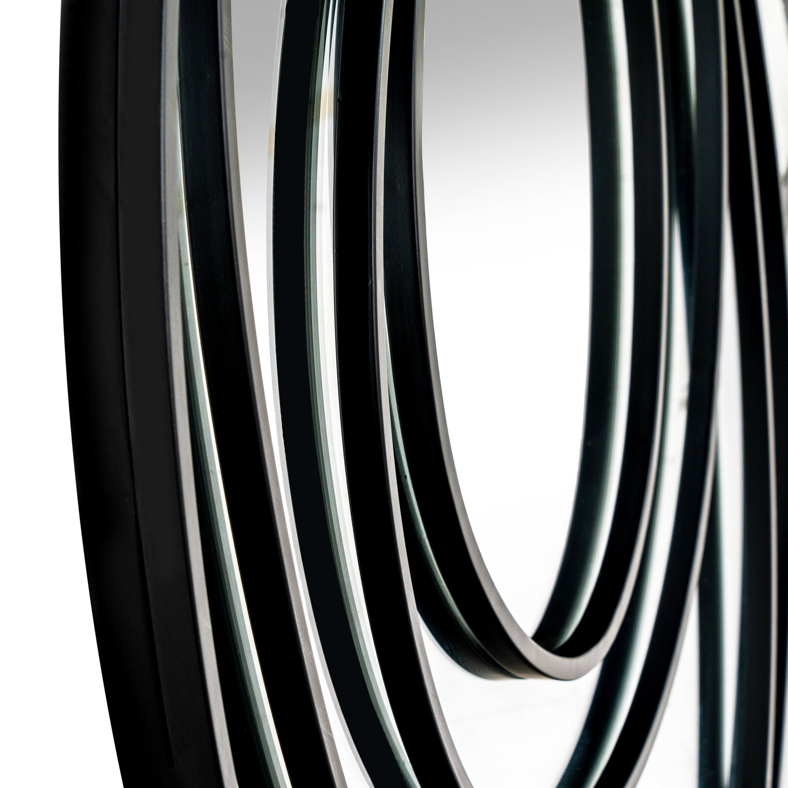 Close-up of black rubber hose on a white background