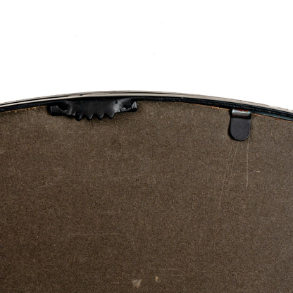 Close-up of a brown leather product with black hardware on a white background