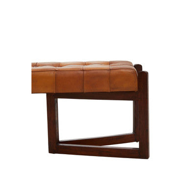 Brown leather ottoman with wooden frame on a white background