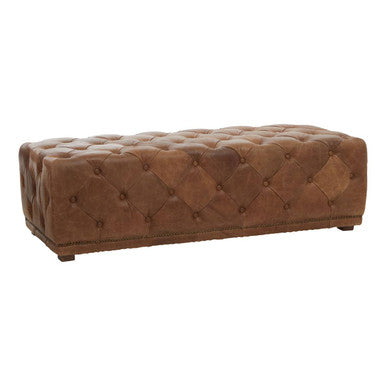 Brown tufted ottoman on a white background