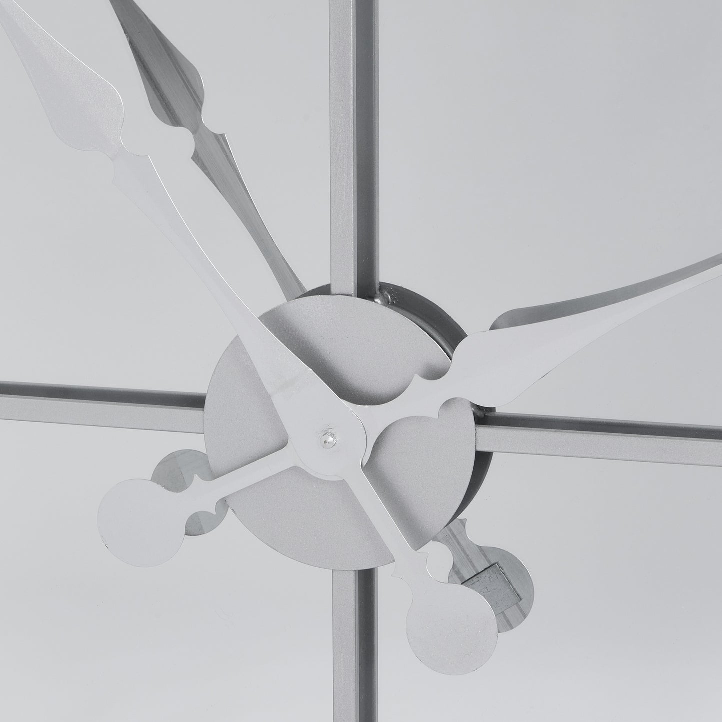 Ceiling fan with metallic blades against a light gray background