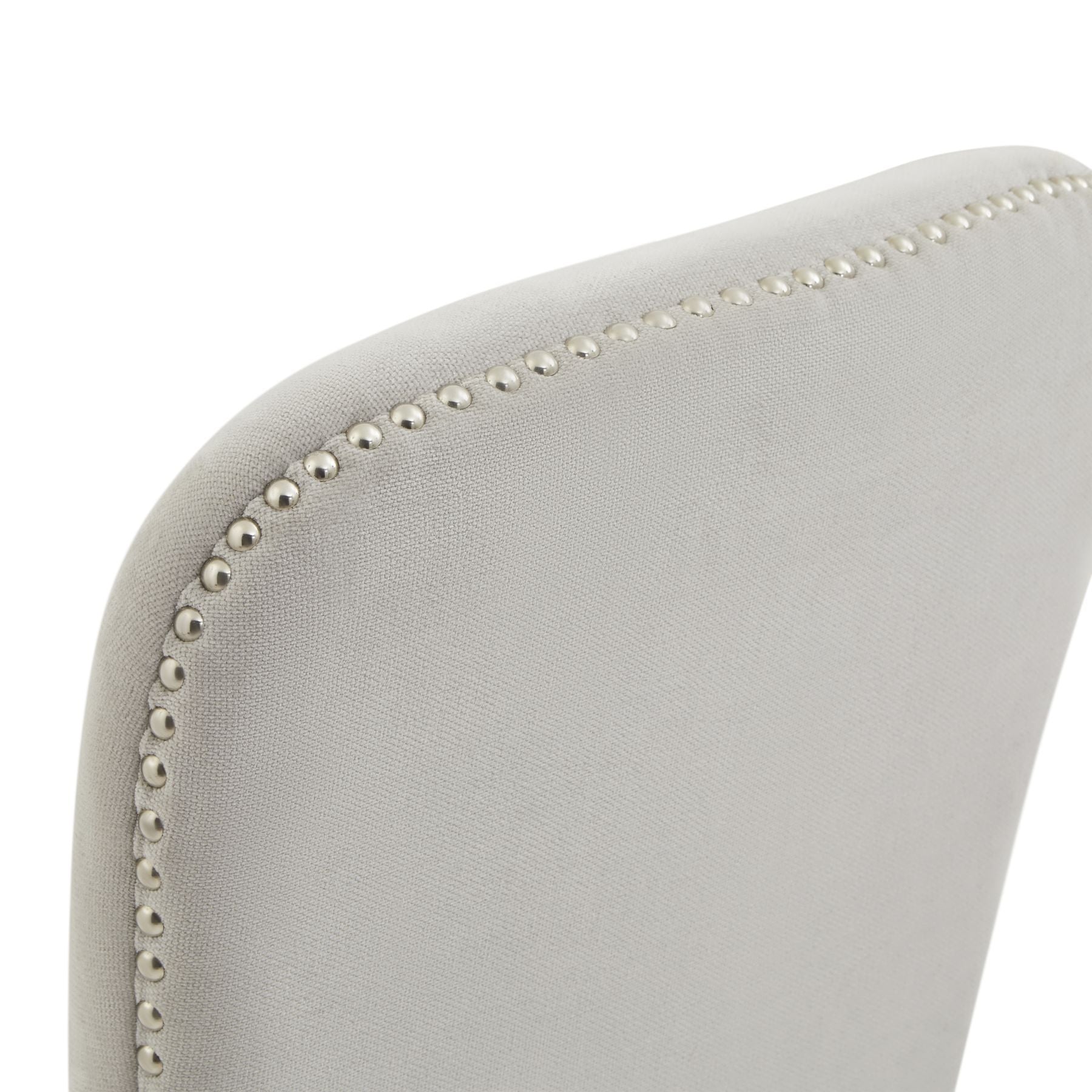 Gray chair with decorative nailhead trim on a white background