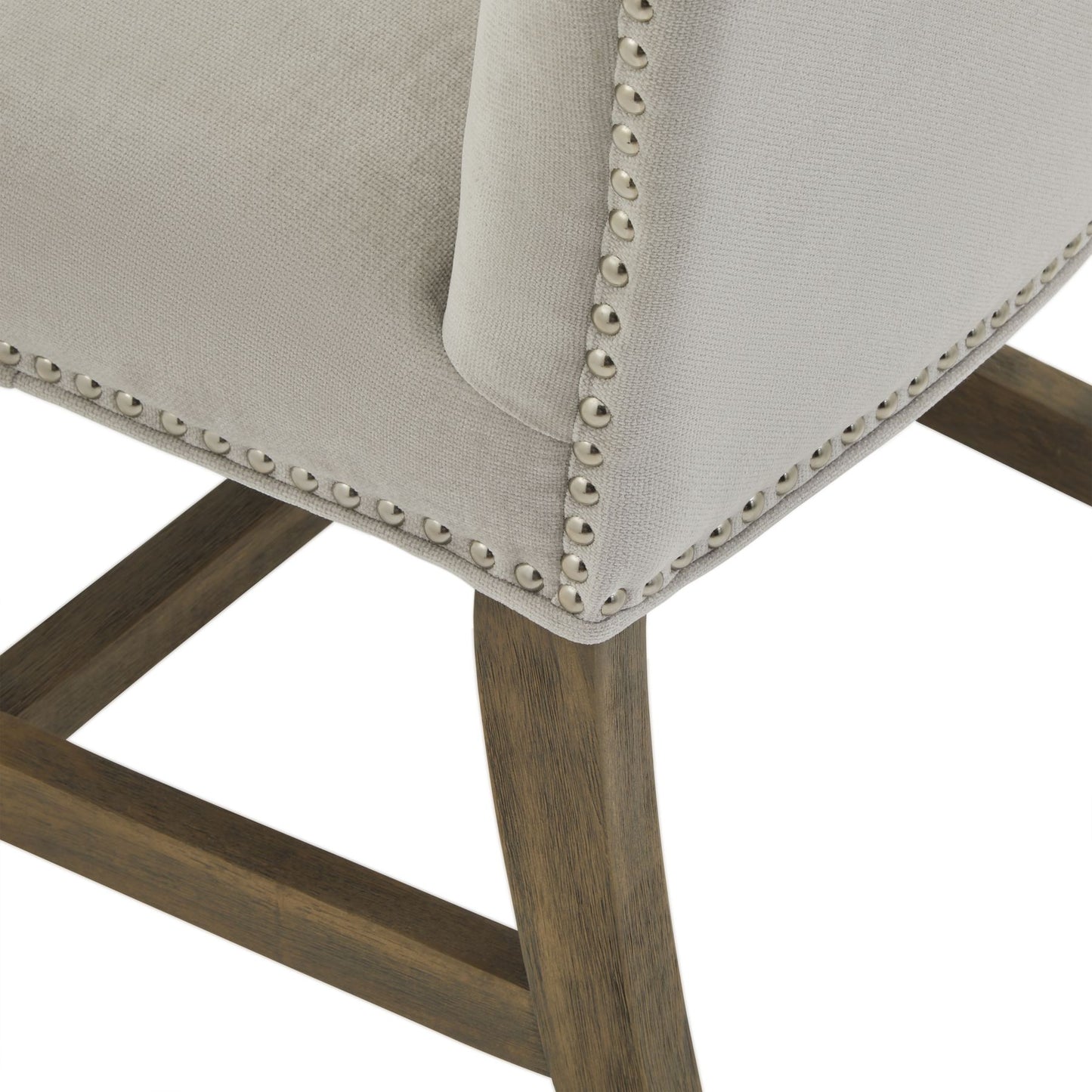 Close-up of a chair with upholstered seat and wooden legs on a white background