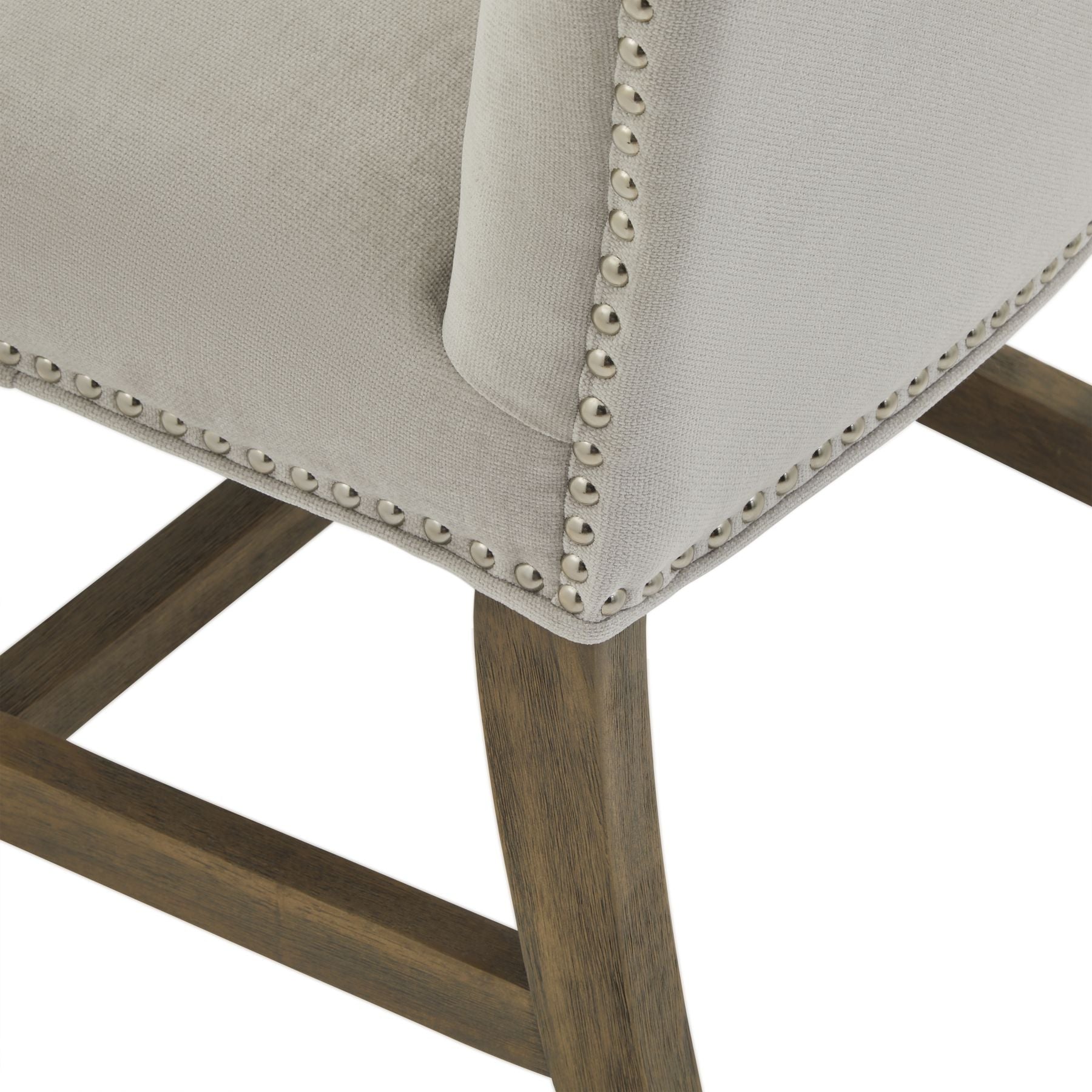 Close-up of a chair with upholstered seat and wooden legs on a white background