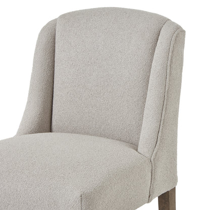 Gray upholstered chair on a white background