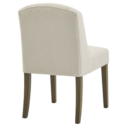 Beige upholstered chair with wooden legs on a white background