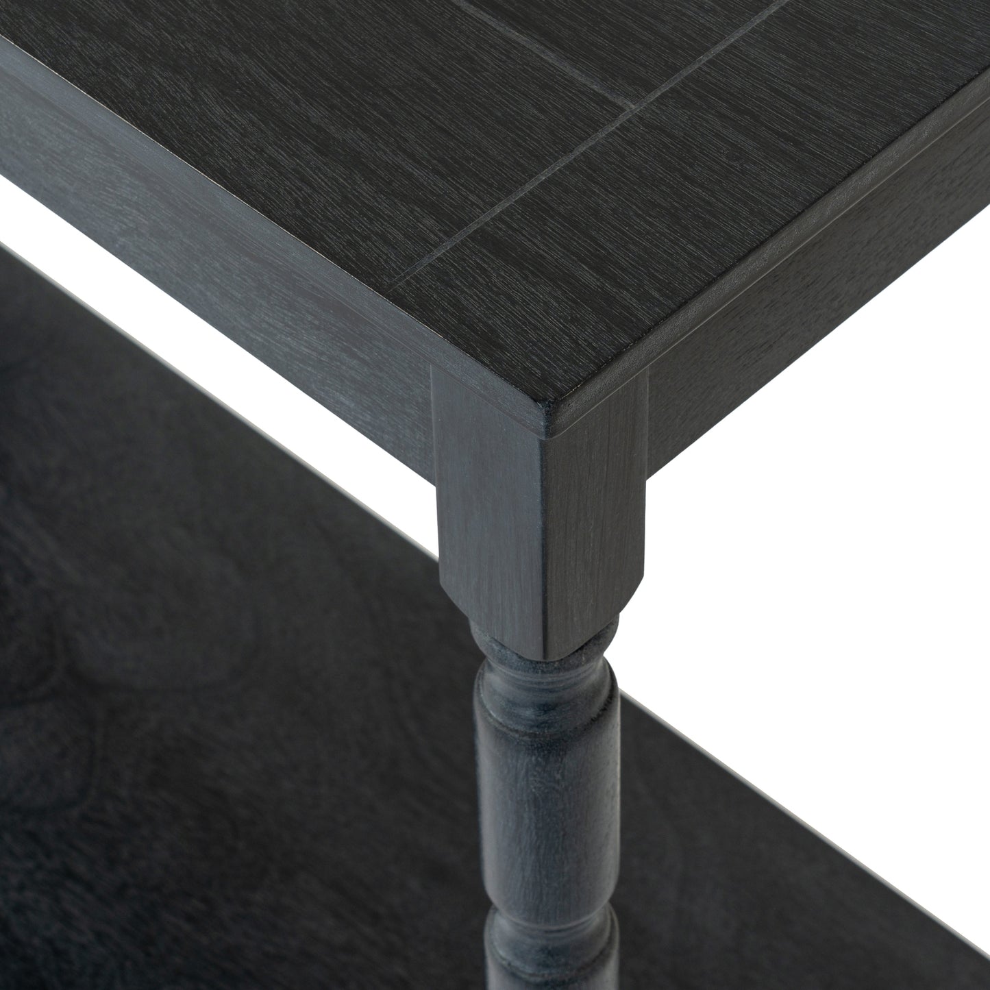 Close-up of a dark wooden table corner with a white background
