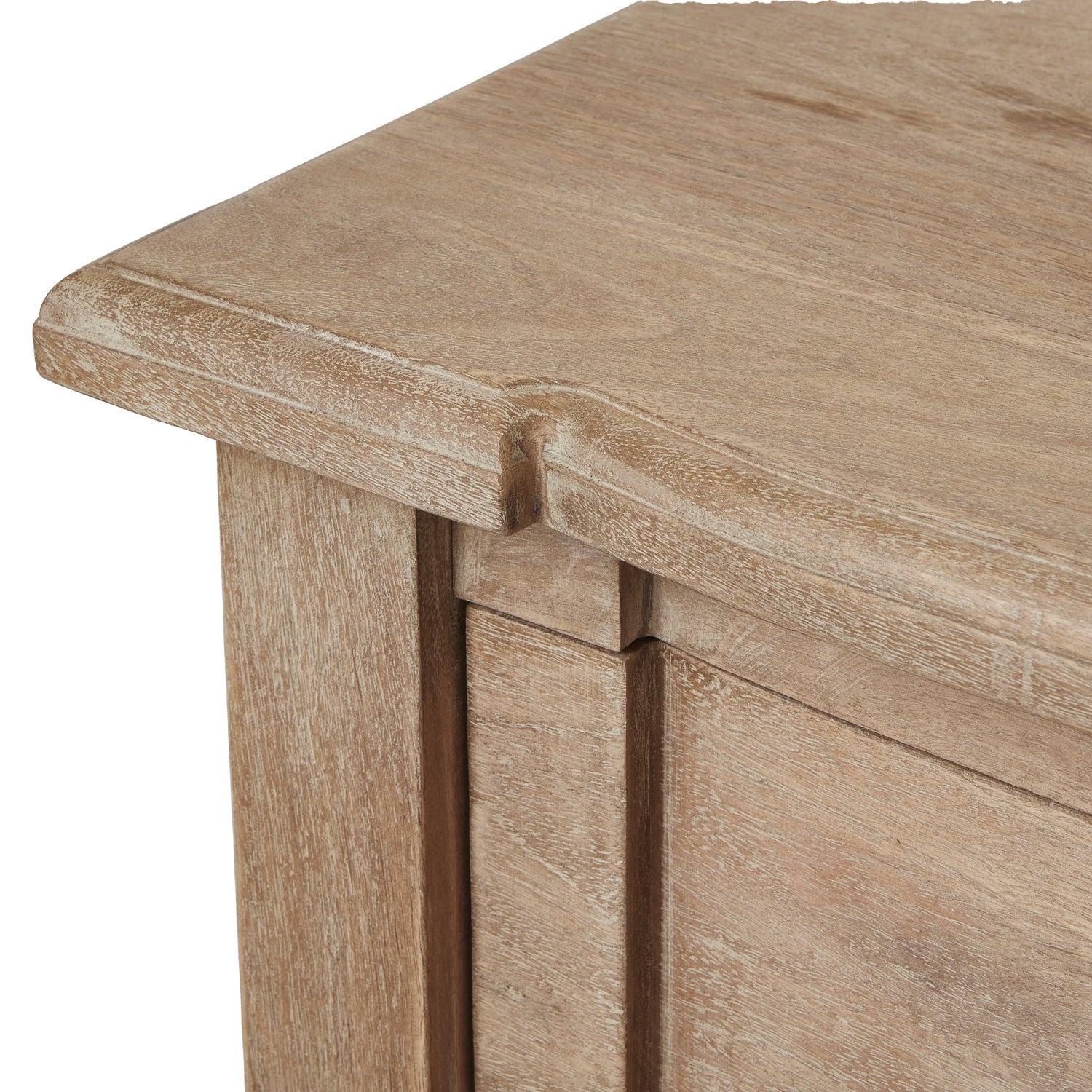 Close-up of a wooden table corner with a light brown finish.