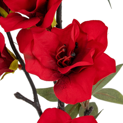 Close-up of red artificial flowers on a white background