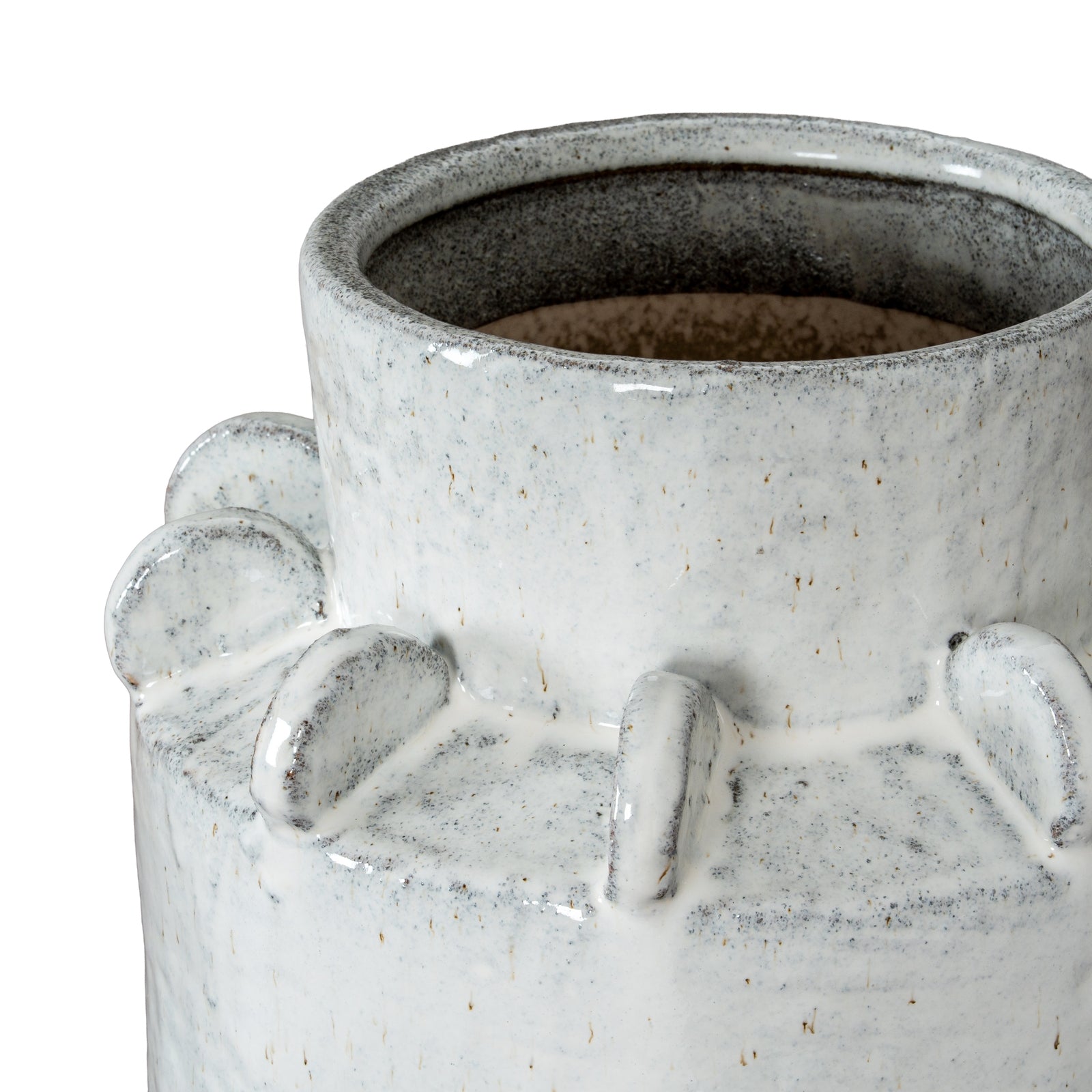 Close-up of a textured ceramic vase with a white and gray speckled design.