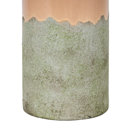 Cylindrical ceramic vase with a textured green base and pink top on a white background