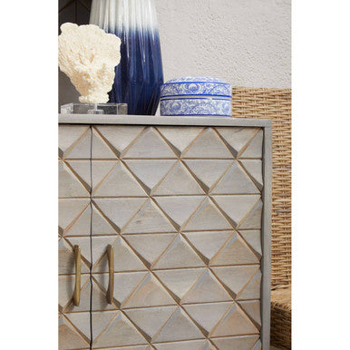 Decorative cabinet with geometric tile pattern on a neutral background