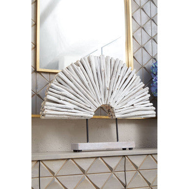 Decorative fan on a shelf with a mirror and tiled wall in the background