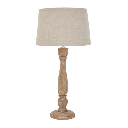 Table lamp with a wooden base and beige fabric shade on a white background