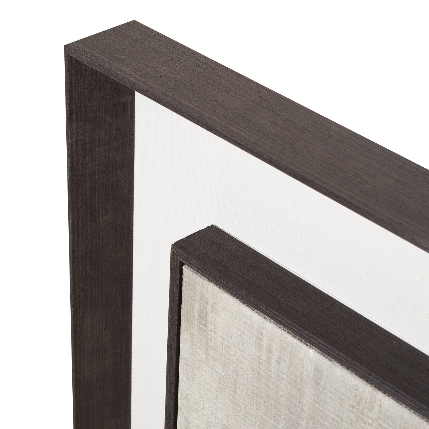 Close-up of a dark wood picture frame corner on a white background