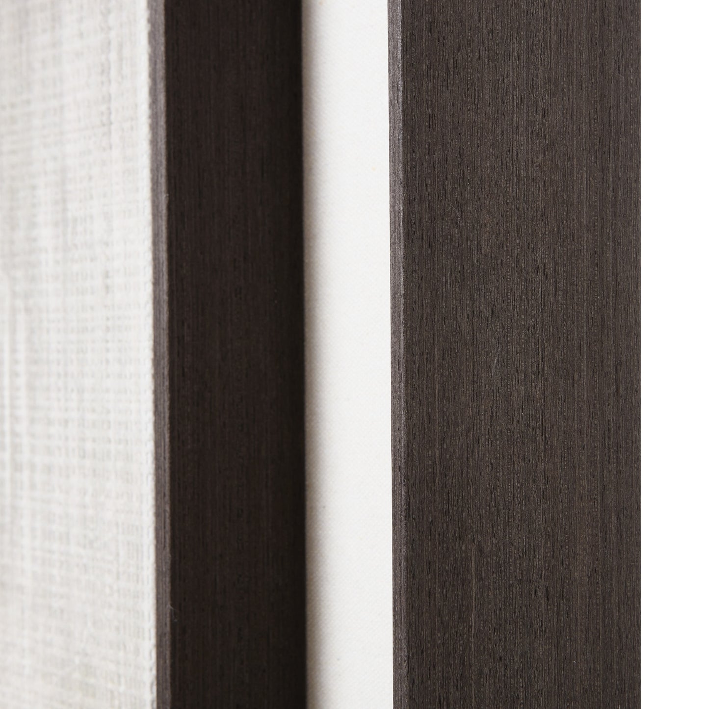 Close-up of fabric swatches in white, dark brown, and gray.