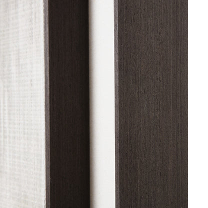 Close-up of fabric swatches in white, dark brown, and gray.