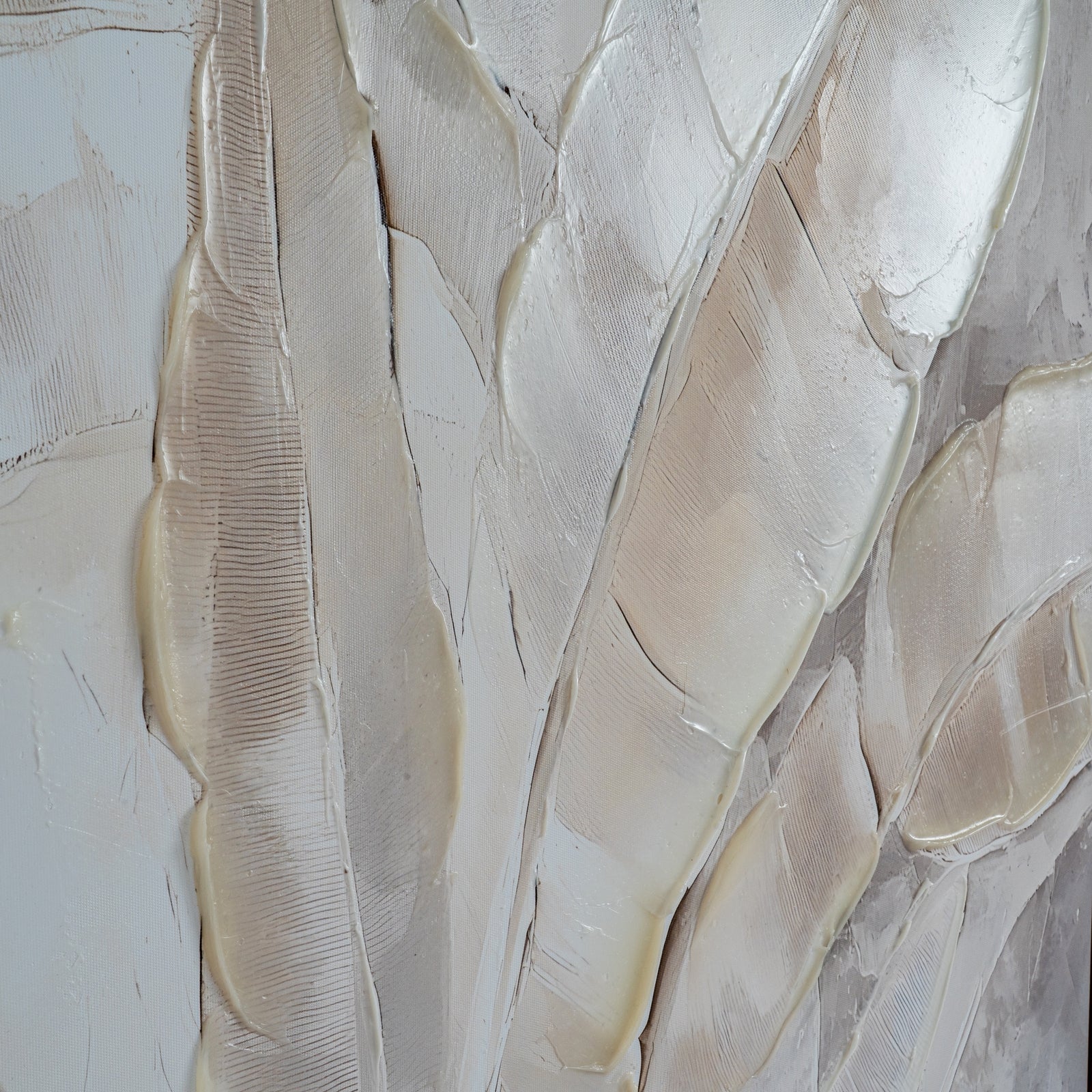 Abstract art piece with textured beige and white patterns