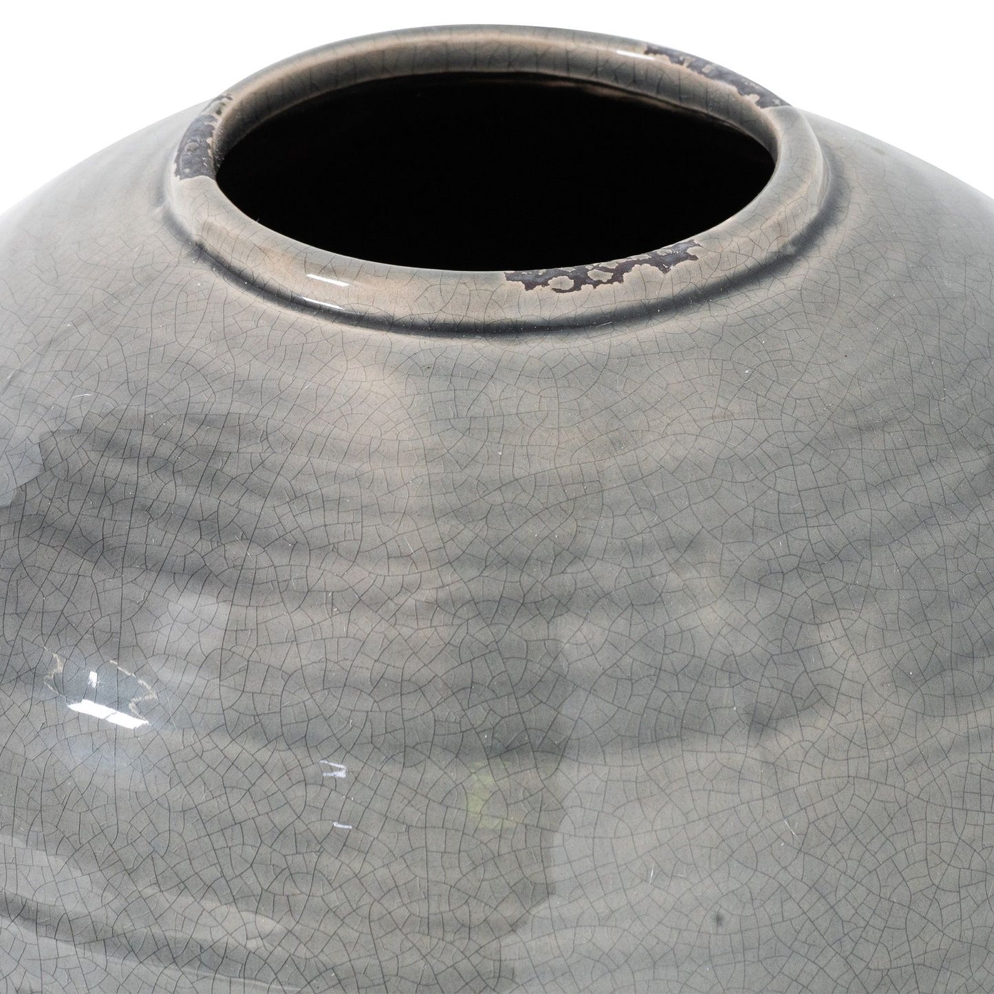 Gray ceramic vase with textured surface on a white background