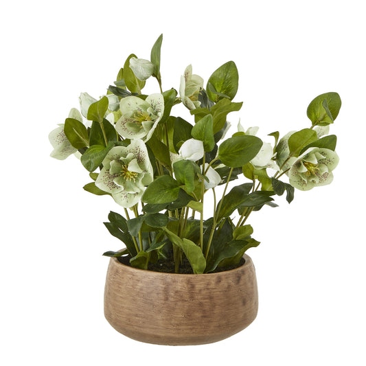 Artificial plant with white flowers in a wooden pot on a white background