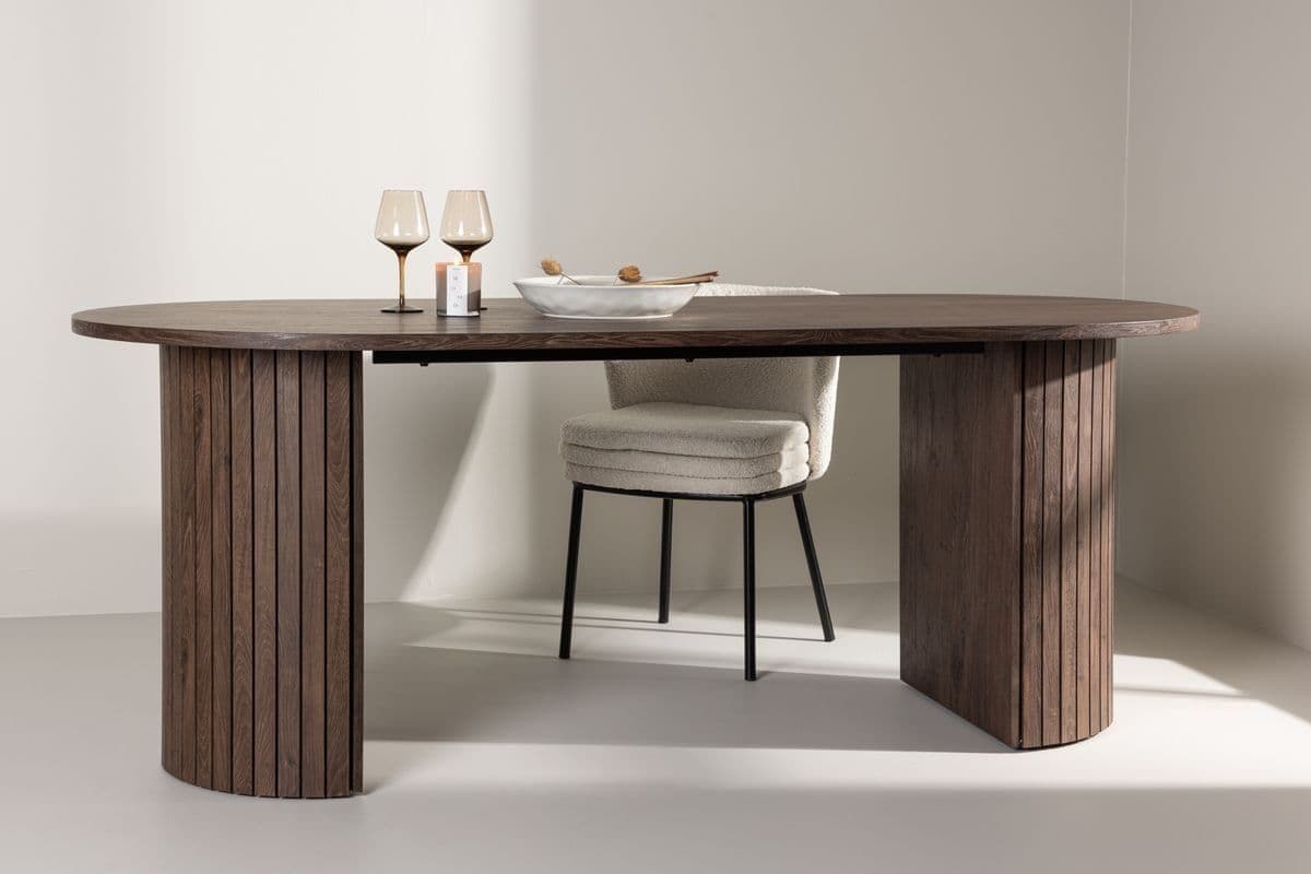Wooden dining table with a chair in a minimalistic setting
