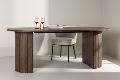 Wooden dining table with a chair in a minimalistic setting