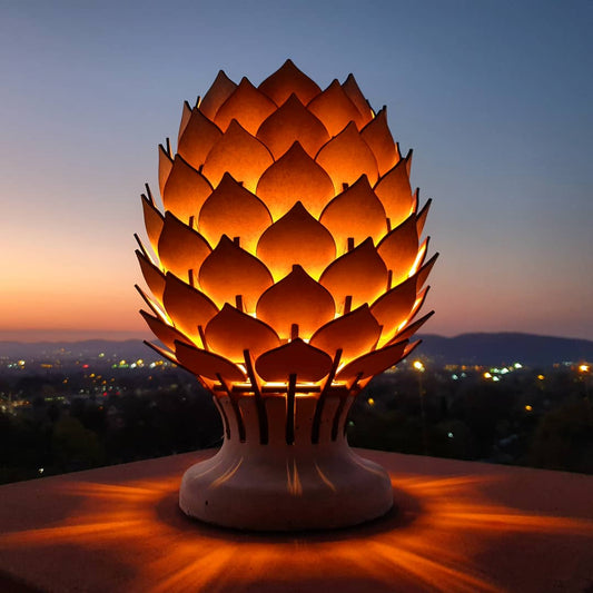 Decorative lamp shaped like a flower with a cityscape in the background