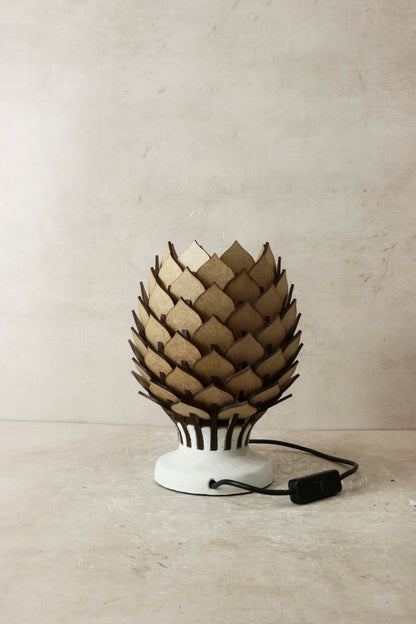 Decorative lamp with unique design on a neutral background