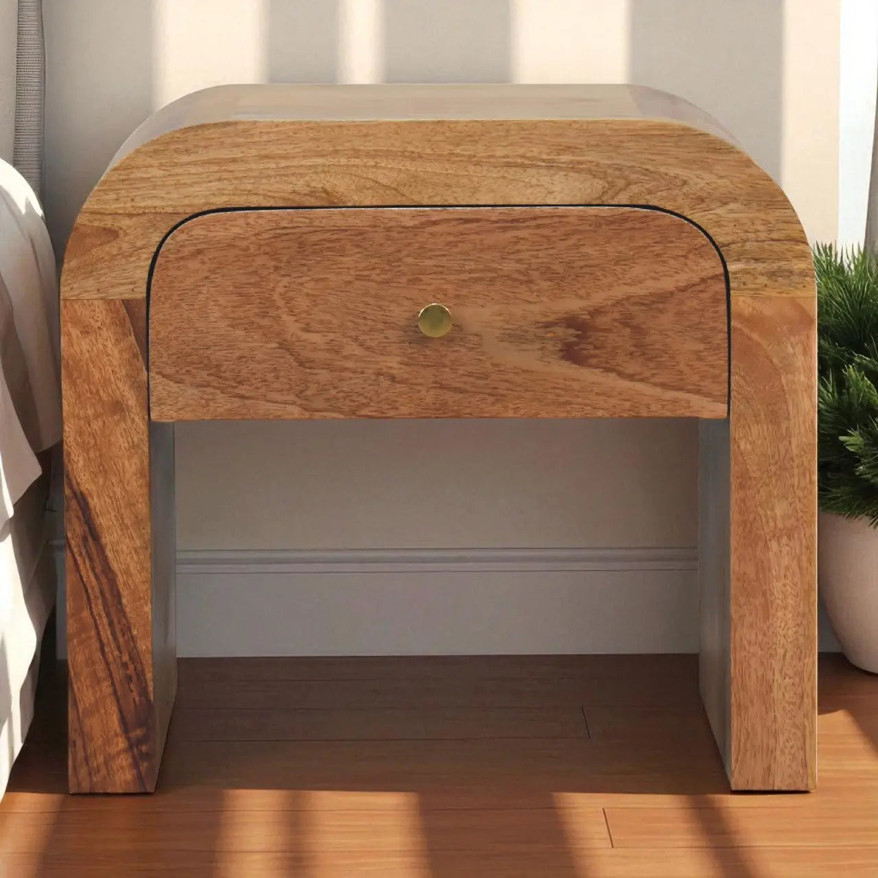 Wooden nightstand with a single drawer in a bedroom setting
