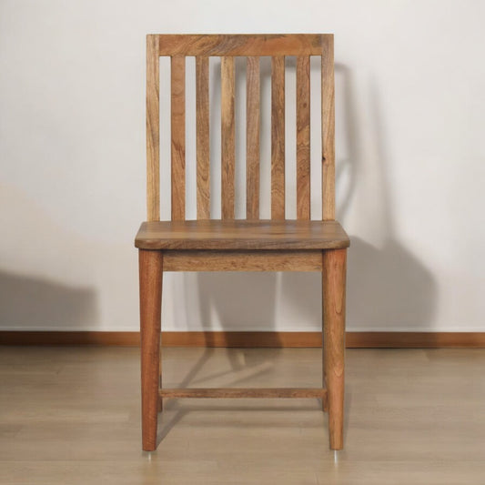 Wooden chair against a plain wall